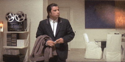 John Travolta from pulp fiction looking around confused GIF